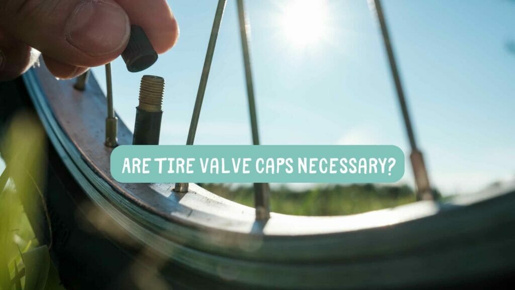 Photo of a person plugging a tire valve cap into a bicycle tire. Are tire valve caps necessary?