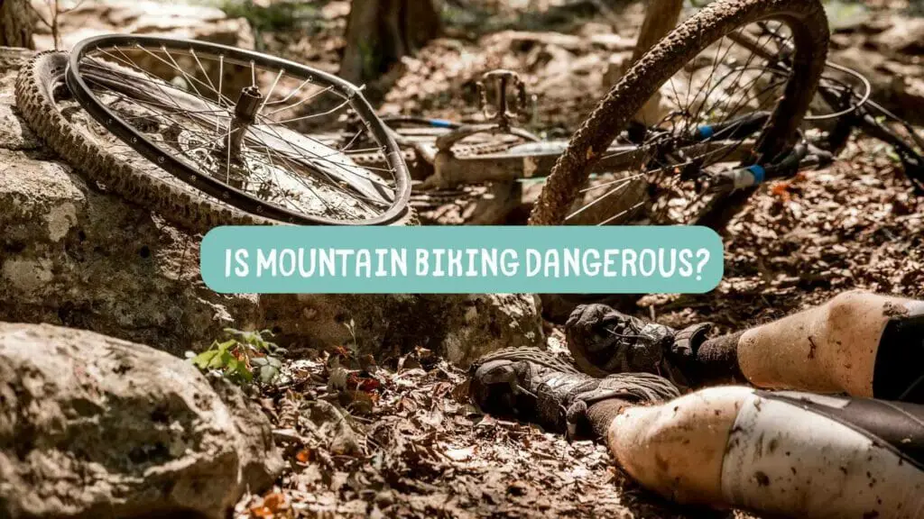 Photo of a person laying on the ground after having a mountain bike accident. Is mountain biking dangerous?