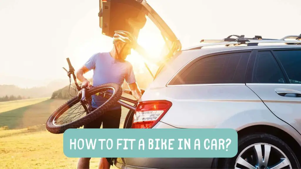 Photo of a cyclist trying to fit his mountain bike in a car trunk. How to Fit a Bike in a Car?