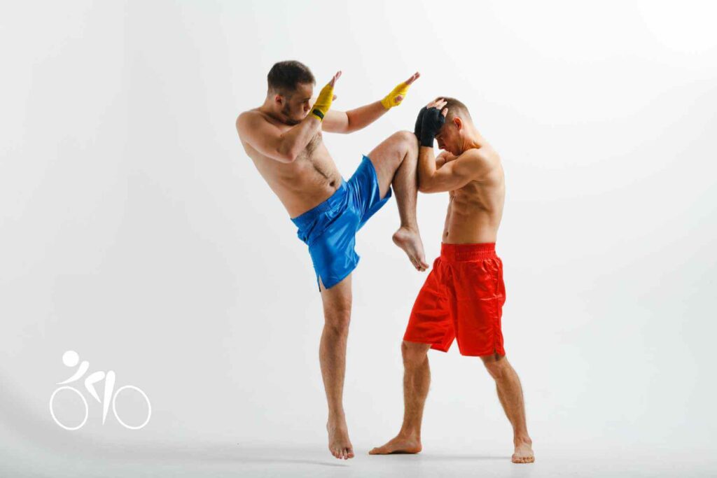 Photo of two men training Muay Thai.