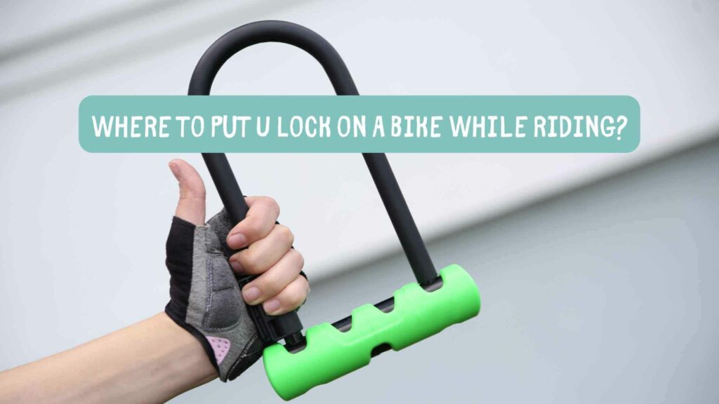 Photo of a U Lock with a green cover on the bottom and a person's hand giving a thumbs up. Where to Put U Lock on Bike While Riding?